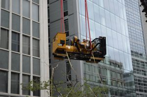 Generator installed for Verizon being hoisted to the rooftop